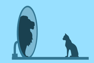 Chat qui voit un lion dans le miroir